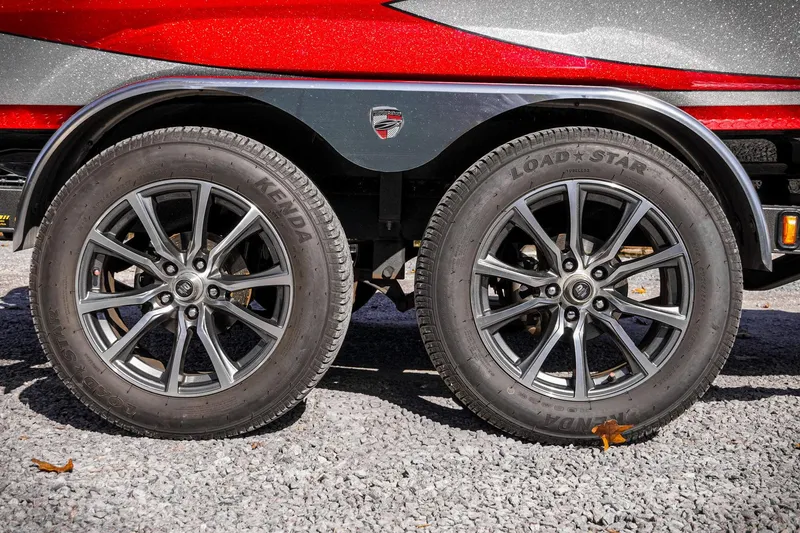 Slide: The Image of 2024 Triton 20XP trailer with Kenda Load Star tires on gravel surface. - 39