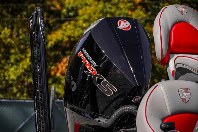 Slide: The Image of 2024 Triton 20XP boat with Mercury Pro XS engine and Power-Pole, featuring red and gray seats. - 42