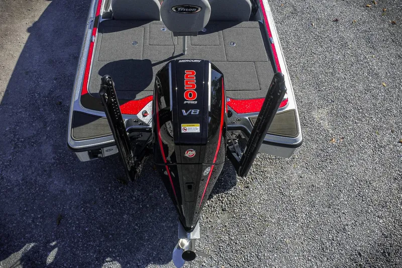 Slide: The Image of 2024 Triton 20XP boat with Mercury 250 Pro V8 engine, rear view. - 7