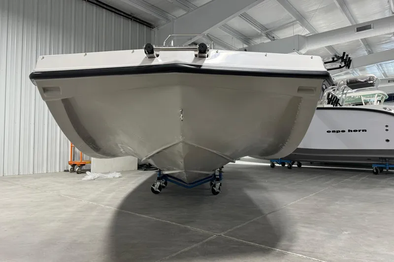 Slide: The Image of 2025 Starcraft SVX 211 OB CC boat in showroom, front view. - 4