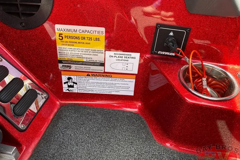 Slide: The Image of 2020 Ranger Z520L boat interior with capacity warning and Evinrude power outlet. - 100