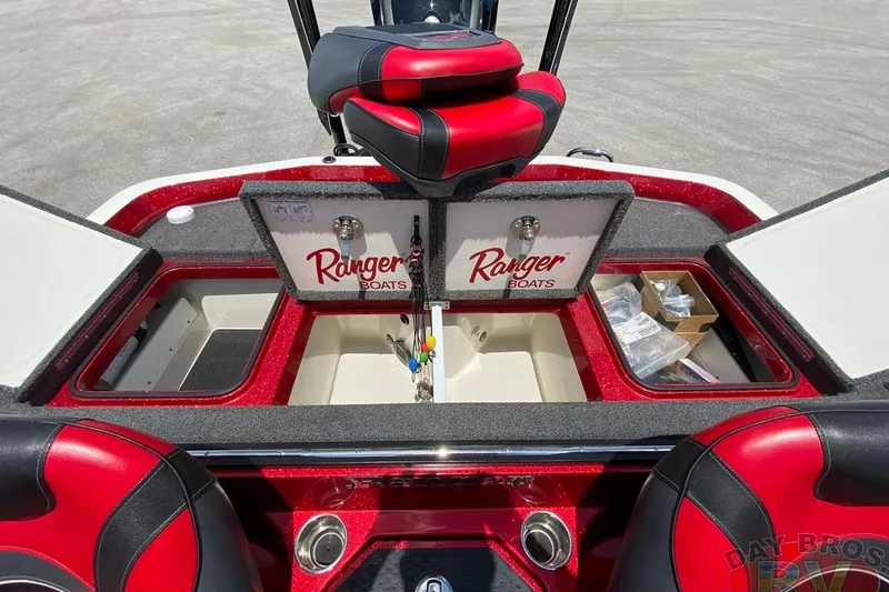 Slide: The Image of 2020 Ranger Z520L boat interior with storage compartments and red-black seating. - 104