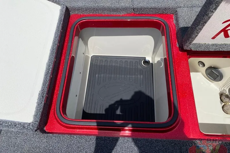 Slide: The Image of 2020 Ranger Z520L boat storage compartment with red trim and black mat. - 105