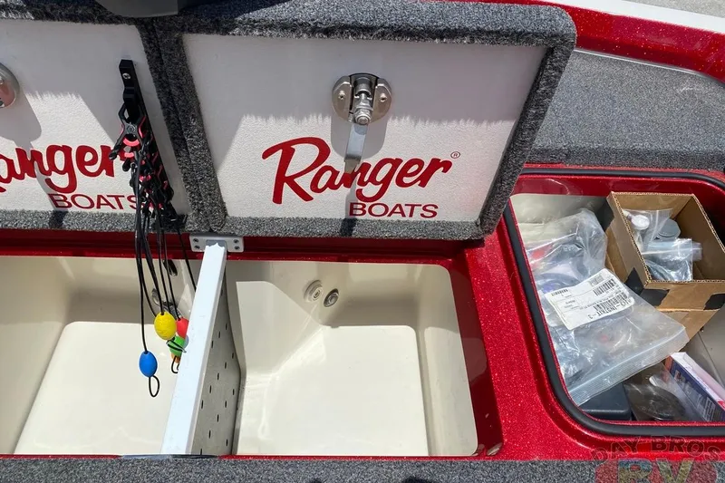 Slide: The Image of 2020 Ranger Z520L boat storage compartments with fishing gear and accessories. - 107