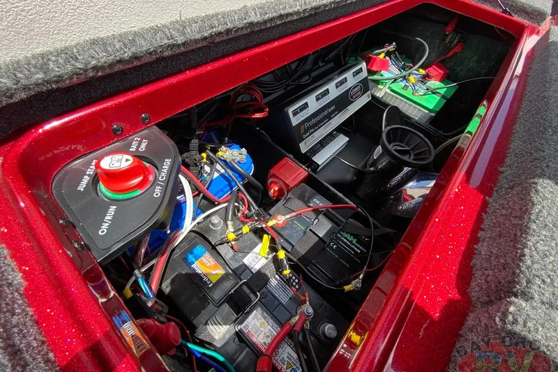 Slide: The Image of 2020 Ranger Z520L boat battery compartment with wiring and control panel. - 109