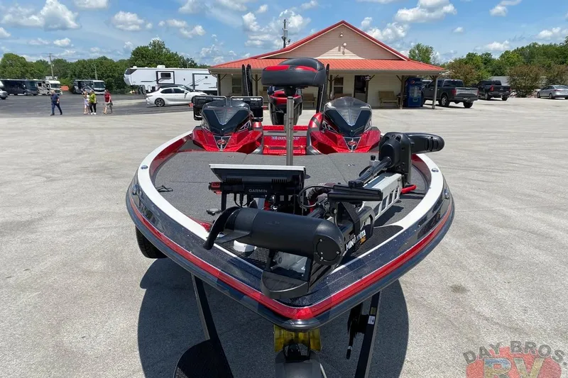 Slide: The Image of 2020 Ranger Z520L boat with advanced Garmin and Minn Kota equipment, parked outdoors. - 11