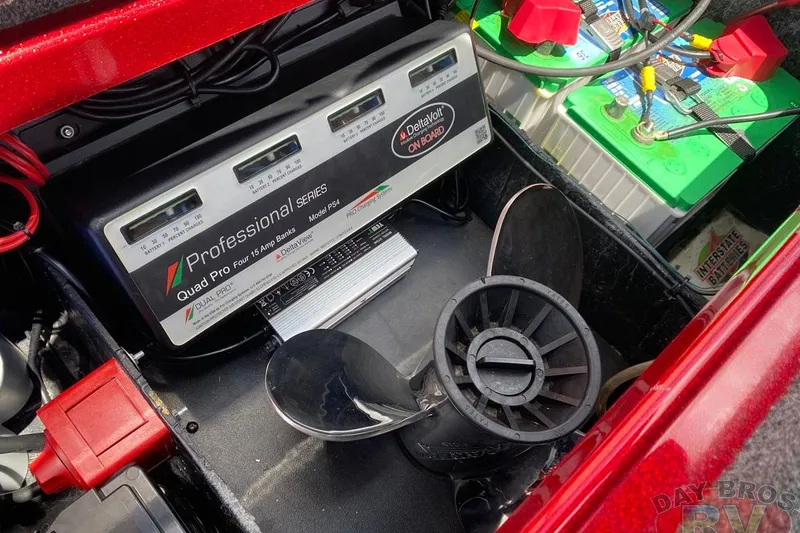 Slide: The Image of 2020 Ranger Z520L boat battery compartment with charger and propeller. - 111