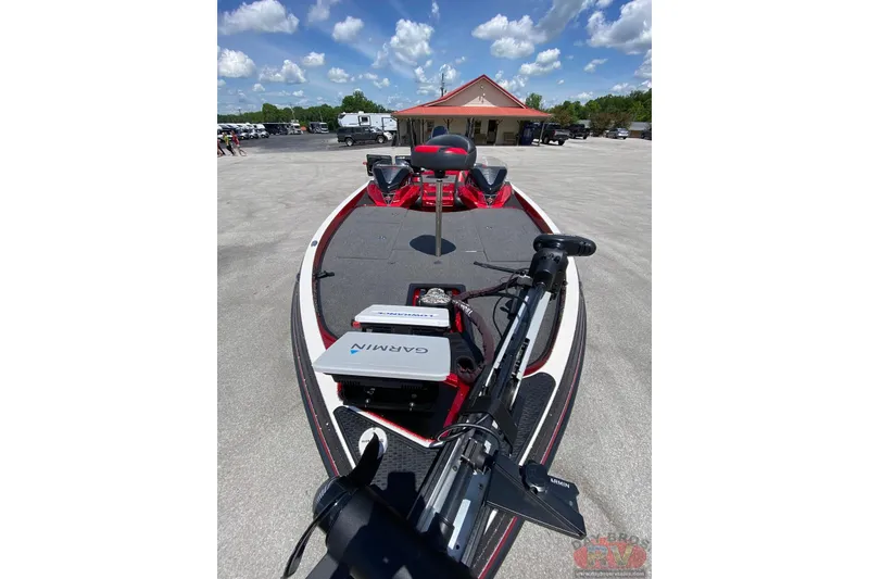Slide: The Image of 2020 Ranger Z520L boat with Garmin equipment, parked under a clear blue sky. - 12