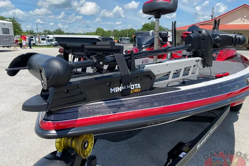 Slide: The Image of 2020 Ranger Z520L boat with Minn Kota Ultrex trolling motor in a parking lot. - 16