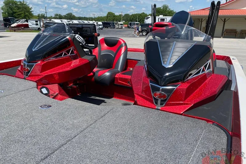 Slide: The Image of 2020 Ranger Z520L boat with red and black design, parked outdoors. - 23