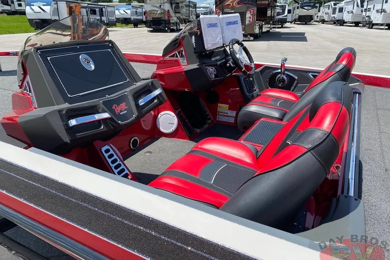 Slide: The Image of 2020 Ranger Z520L boat interior with red and black seats, advanced dashboard controls. - 24
