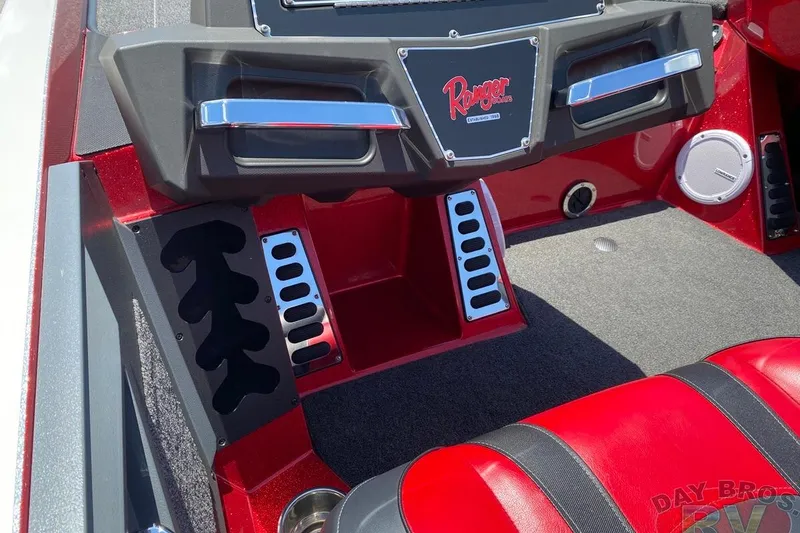 Slide: The Image of 2020 Ranger Z520L boat interior with red and black accents, featuring sleek dashboard design. - 26