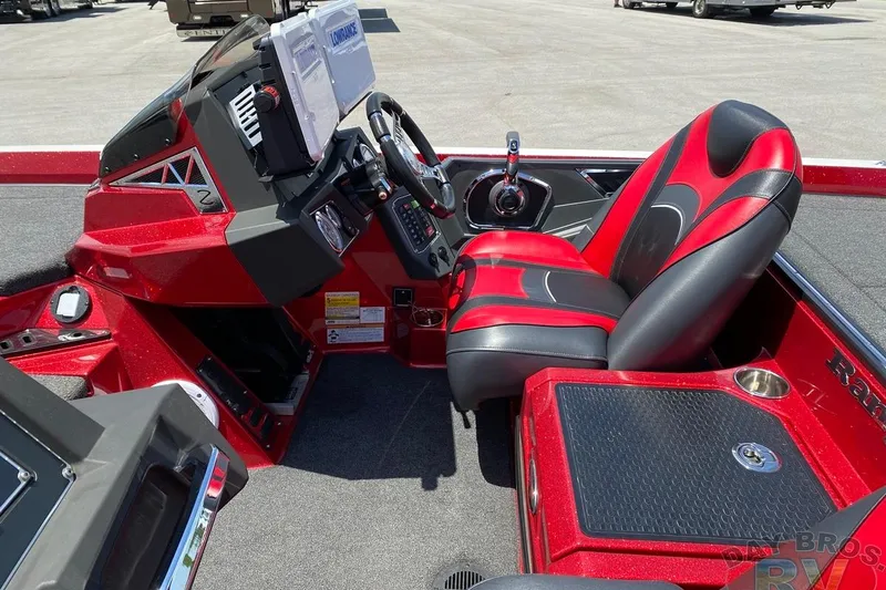 Slide: The Image of 2020 Ranger Z520L boat interior with red and black seating, steering console, and navigation equipment. - 27