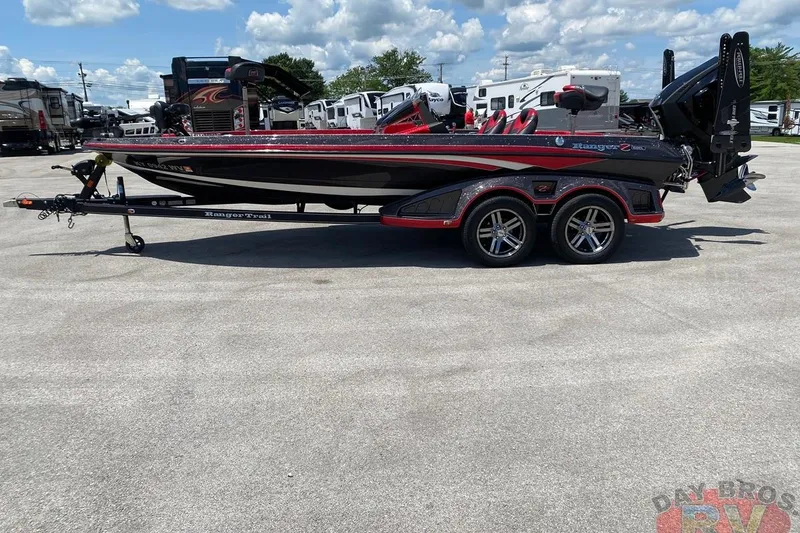 Slide: The Image of 2020 Ranger Z520L boat on trailer in parking lot, clear sky background. - 31