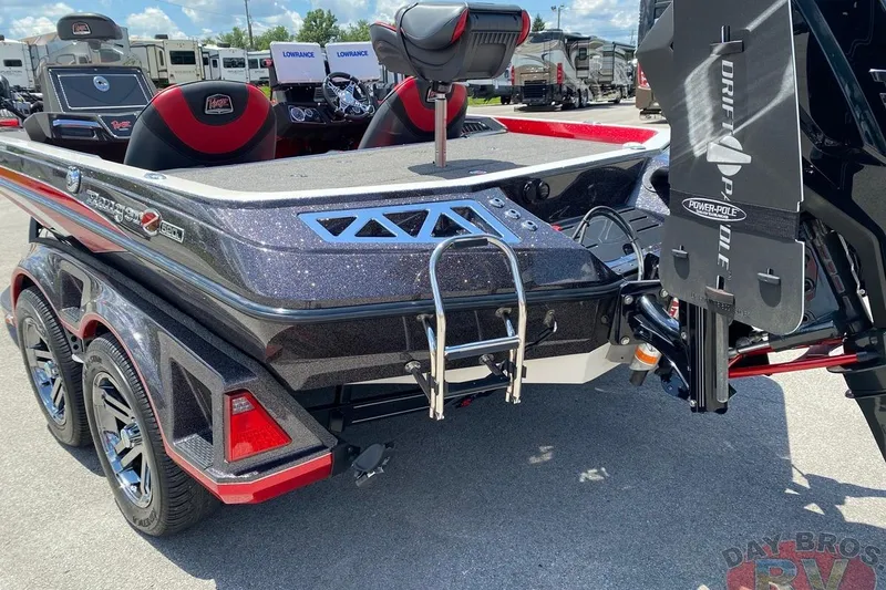 Slide: The Image of 2020 Ranger Z520L boat with Power-Pole anchor, parked outdoors at dealership. - 34
