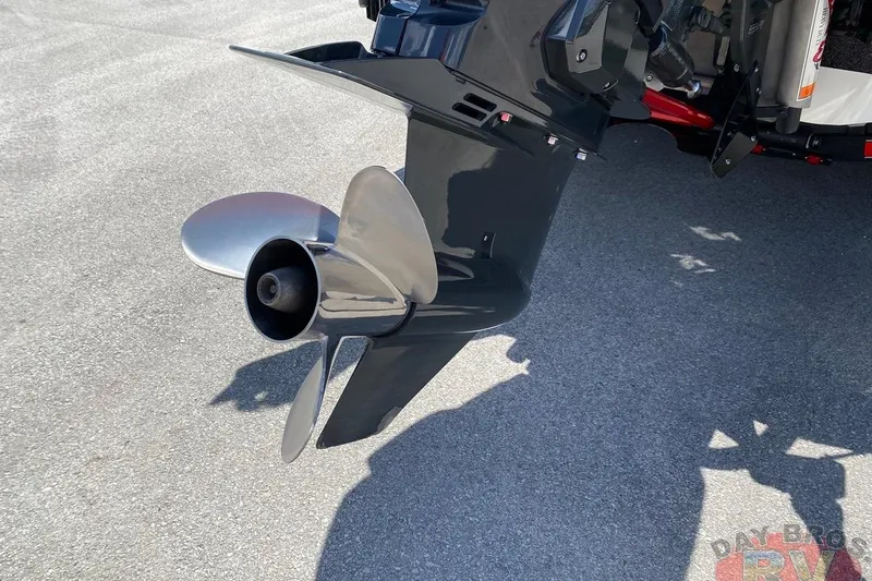 Slide: The Image of 2020 Ranger Z520L boat propeller on asphalt surface, close-up view. - 41