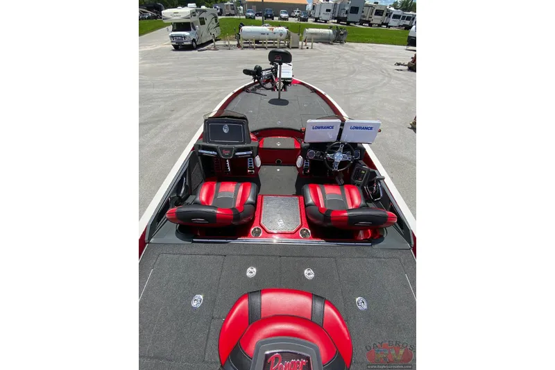 Slide: The Image of 2020 Ranger Z520L boat interior with red seats and dual Lowrance displays. - 5