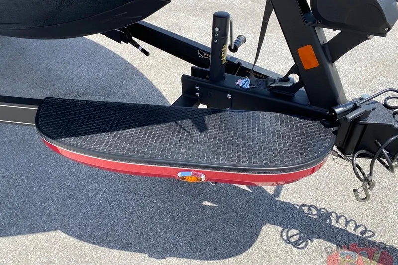 Slide: The Image of 2020 Ranger Z520L boat trailer step with textured surface on pavement. - 61