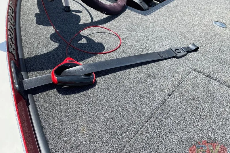 Slide: The Image of 2020 Ranger Z520L boat deck with a black and red strap securing equipment. - 67