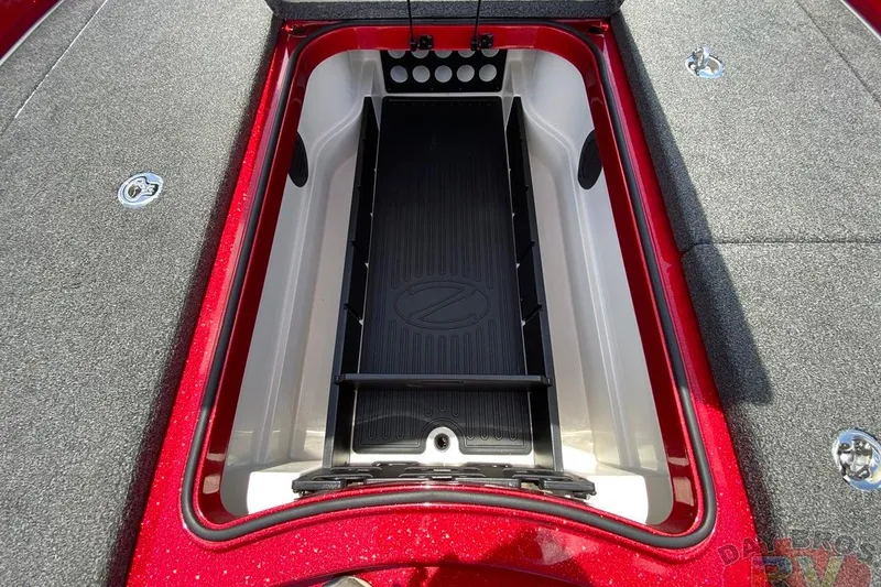 Slide: The Image of 2020 Ranger Z520L boat storage compartment with red trim and gray carpet. - 78