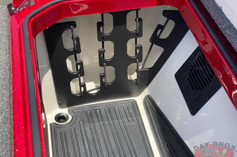 Slide: The Image of 2020 Ranger Z520L storage compartment with rod holders and red exterior. - 81