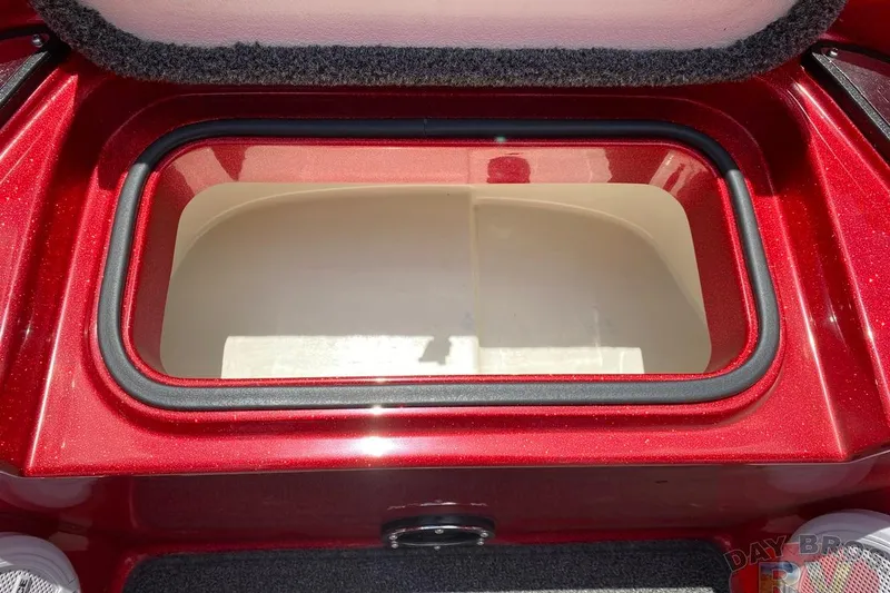 Slide: The Image of Open storage compartment in 2020 Ranger Z520L boat, featuring a red exterior. - 84