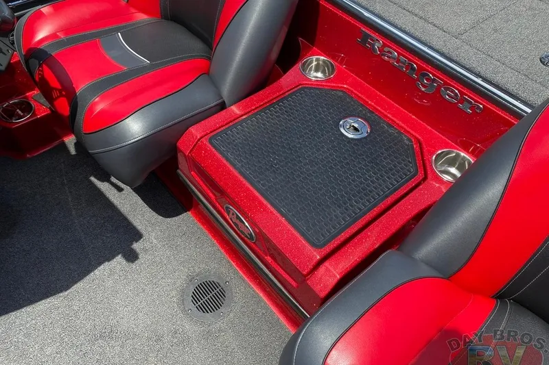 Slide: The Image of 2020 Ranger Z520L boat interior with red and black seats and storage compartment. - 91