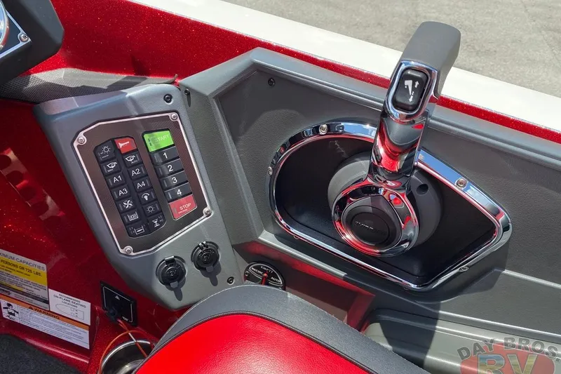 Slide: The Image of 2020 Ranger Z520L boat control panel with throttle and keypad. - 99