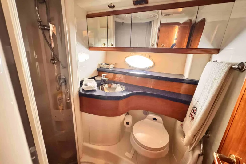 Slide: The Image of Luxurious Cranchi yacht bathroom with modern fixtures, shower, and elegant wood accents. - 17