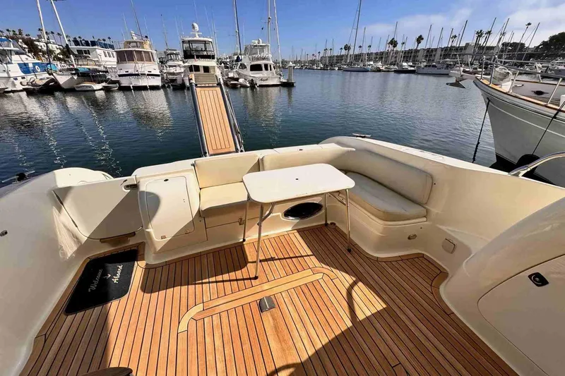Slide: The Image of Luxurious 2003 Cranchi Atlantique 50 yacht with spacious deck and marina view. - 5