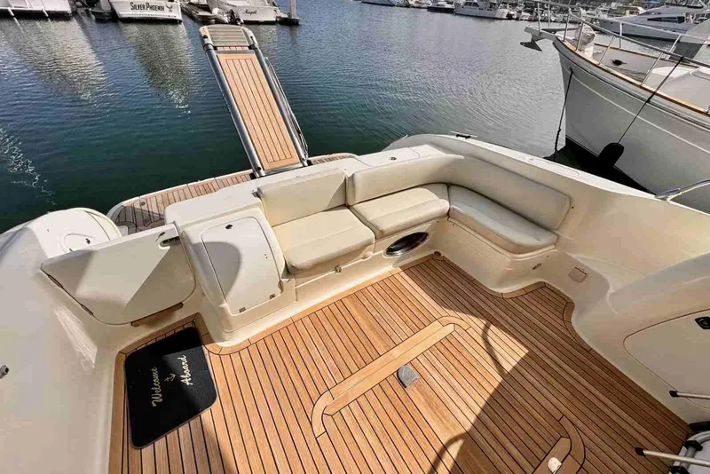 Slide: The Image of Luxurious 2003 Cranchi Atlantique 50 yacht deck with elegant seating and wooden flooring. - 6
