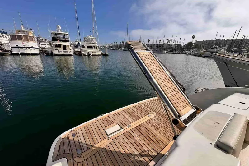 Slide: The Image of Cranchi Atlantique 50 yacht, 2003 model, docked in a marina with wooden deck. - 7