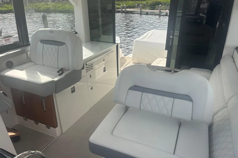 Slide: The Image of Luxurious interior of 2024 Regal 36 XO yacht with plush seating and modern design. - 21