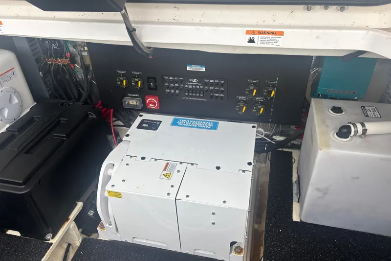 Slide: The Image of Electrical panel and components inside a 2024 Regal 36 XO boat. - 32