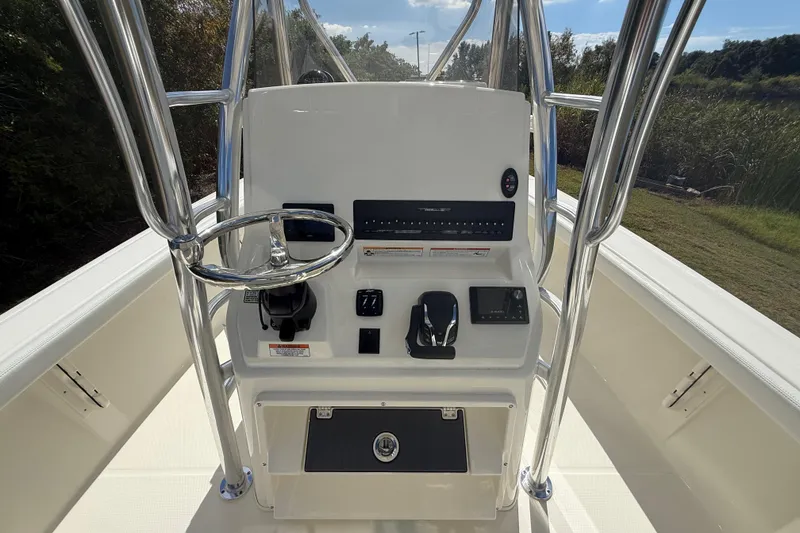 Slide: The Image of 2026 Pathfinder 2400 Open boat console with steering wheel and controls. - 17