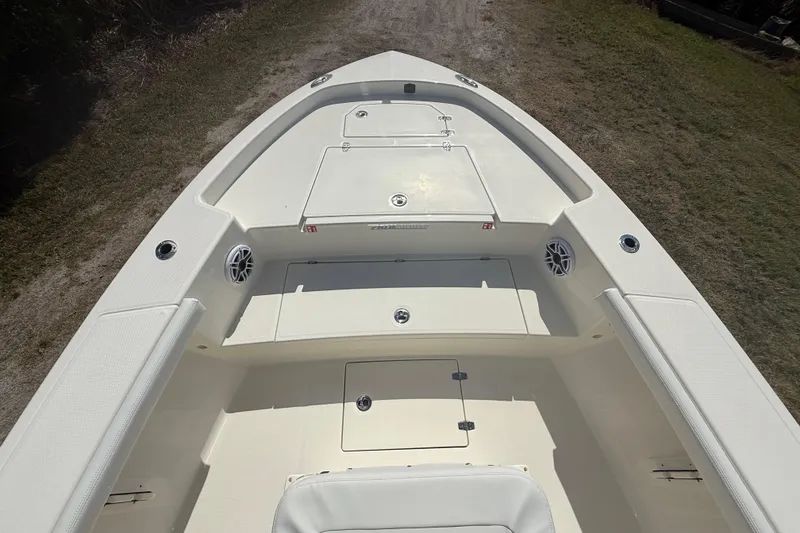 Slide: The Image of 2026 Pathfinder 2400 Open boat deck, featuring spacious seating and storage compartments. - 19