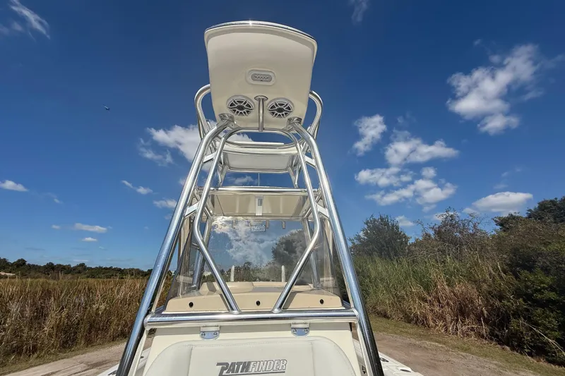 Slide: The Image of 2026 Pathfinder 2400 Open boat with T-top under clear blue sky. - 23