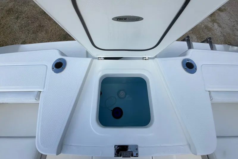 Slide: The Image of 2026 Pathfinder 2400 Open boat livewell with open lid, showcasing interior design. - 29