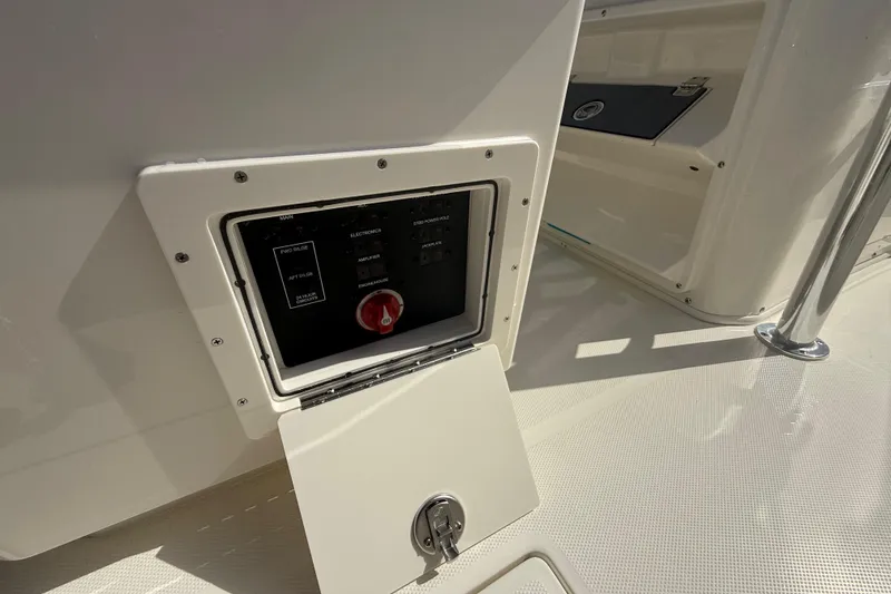 Slide: The Image of Control panel on a 2026 Pathfinder 2400 Open boat, featuring switches and a red knob. - 38