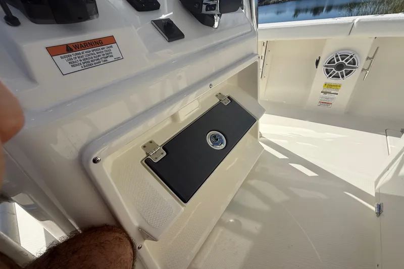 Slide: The Image of 2026 Pathfinder 2400 Open boat interior with storage compartment and speaker. - 41