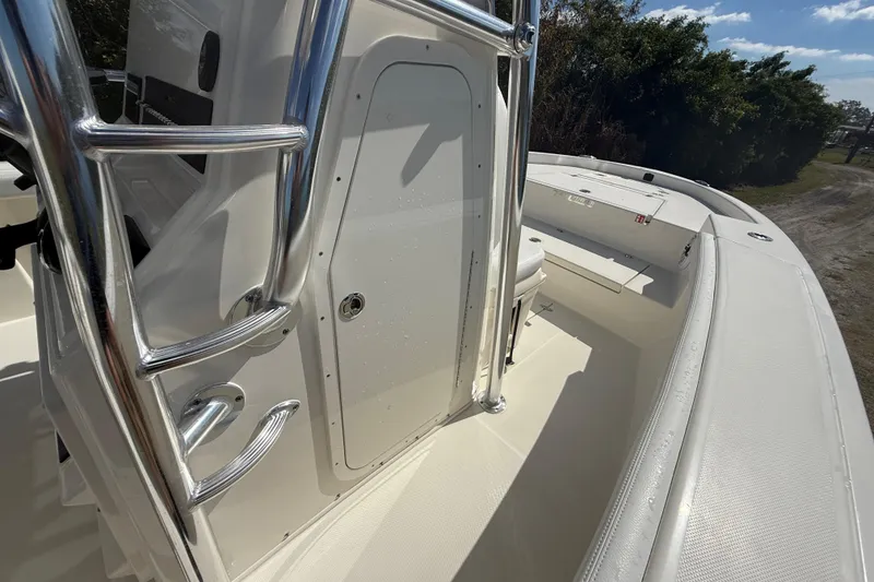 Slide: The Image of 2026 Pathfinder 2400 Open boat deck with sleek design and chrome railings. - 43