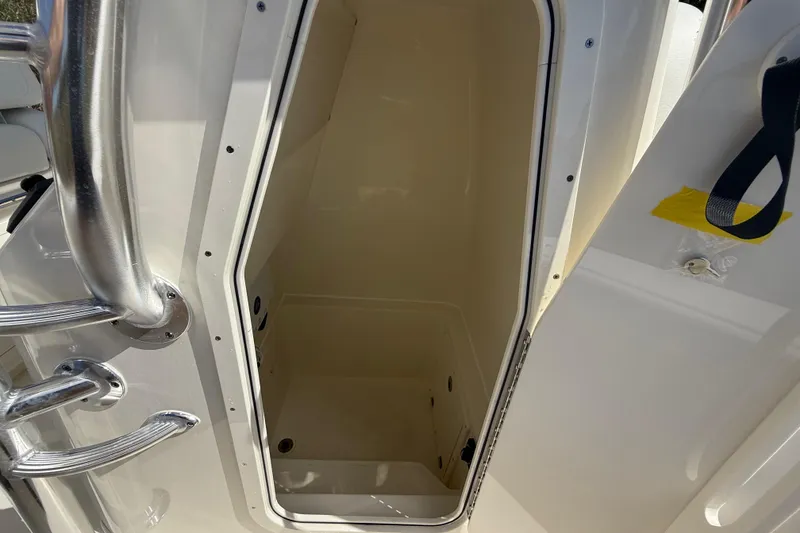Slide: The Image of Storage compartment on 2026 Pathfinder 2400 Open boat, featuring stainless steel handles. - 44