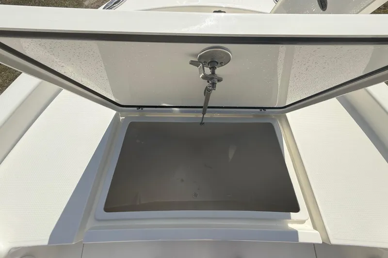 Slide: The Image of Open storage compartment on 2026 Pathfinder 2400 Open boat, showcasing interior space. - 48