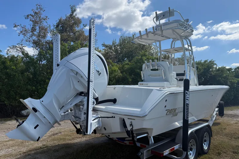 Slide: The Image of 2026 Pathfinder 2400 Open boat on trailer, featuring powerful outboard motor. - 5