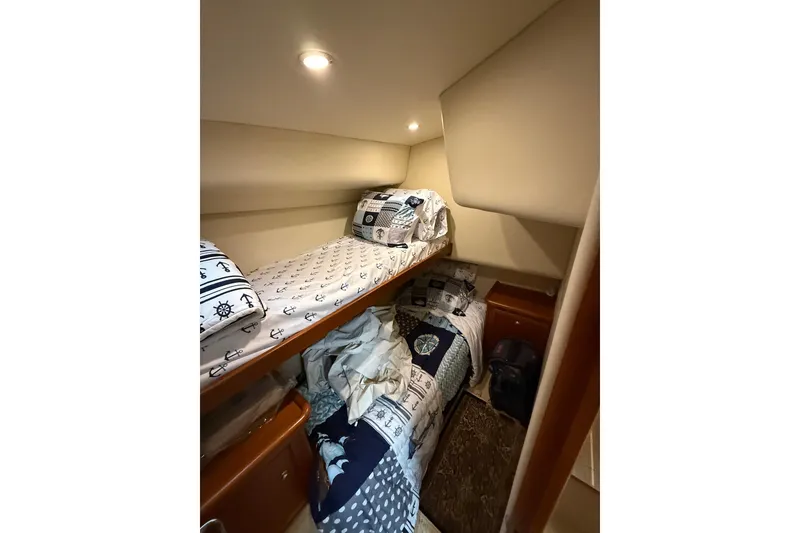 Slide: The Image of Cozy cabin with bunk beds in 2005 Riviera 40 Flybridge yacht. - 11