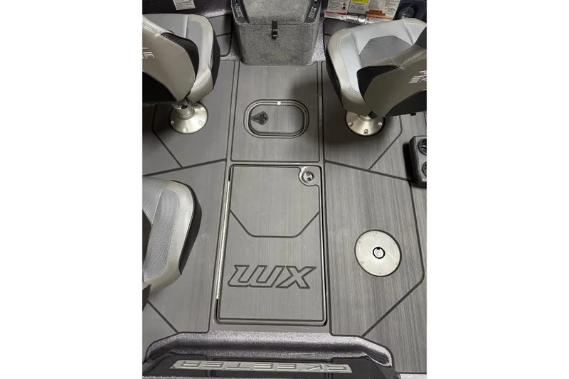 Slide: The Image of 2026 Skeeter WX1910 boat interior with seating and storage compartments. - 10