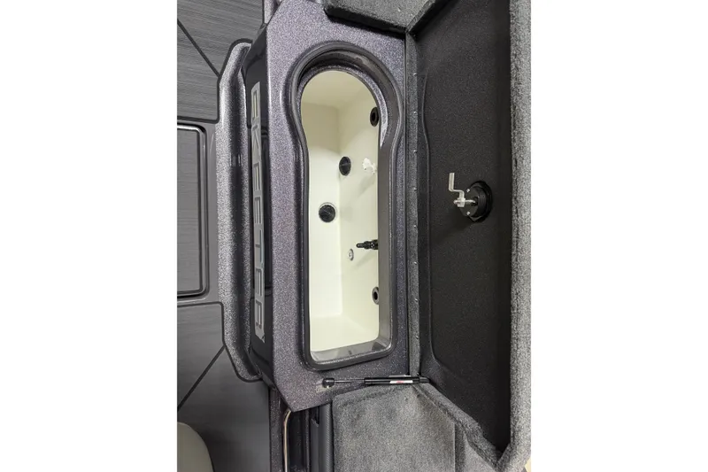 Slide: The Image of 2026 Skeeter WX1910 boat livewell interior with black and white design. - 16