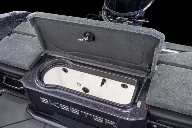 Slide: The Image of Manufacturer Provided Image: 2026 Skeeter WX1910 boat livewell with open lid, showcasing interior design. - 17