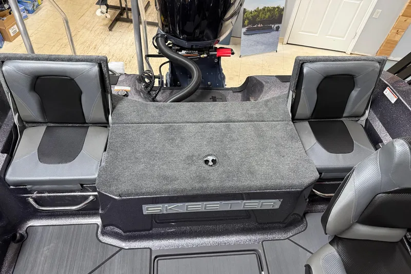 Slide: The Image of 2026 Skeeter WX1910 boat interior with gray seating and carpeted deck. - 18