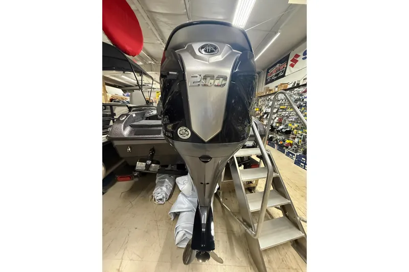 Slide: The Image of 2026 Skeeter WX1910 boat with powerful 200 horsepower engine in showroom. - 3